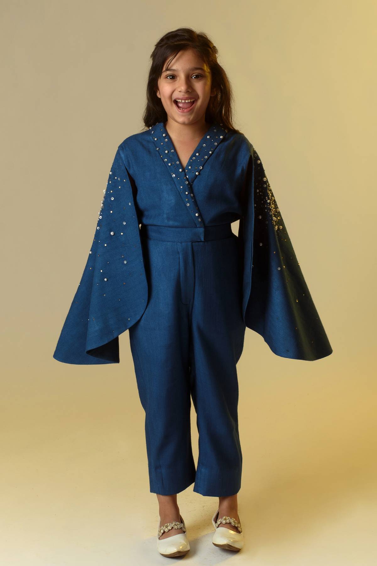 Buy Kids Designer Littleens Organic wool herringbone jumpsuit with super flattering wrap detail, statement embroidered cape sleeves and tailored bottom Online at ScrollnShops