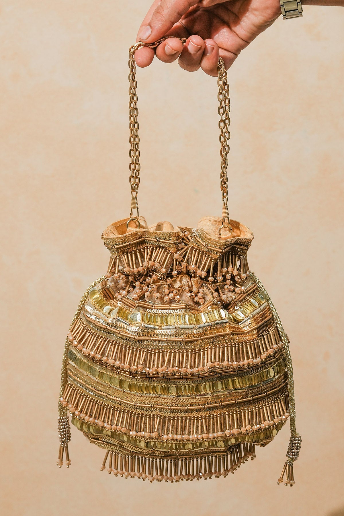 Buy Golden Raw Silk Tassel Potli for women by the Purple sack online available at scrollnshops