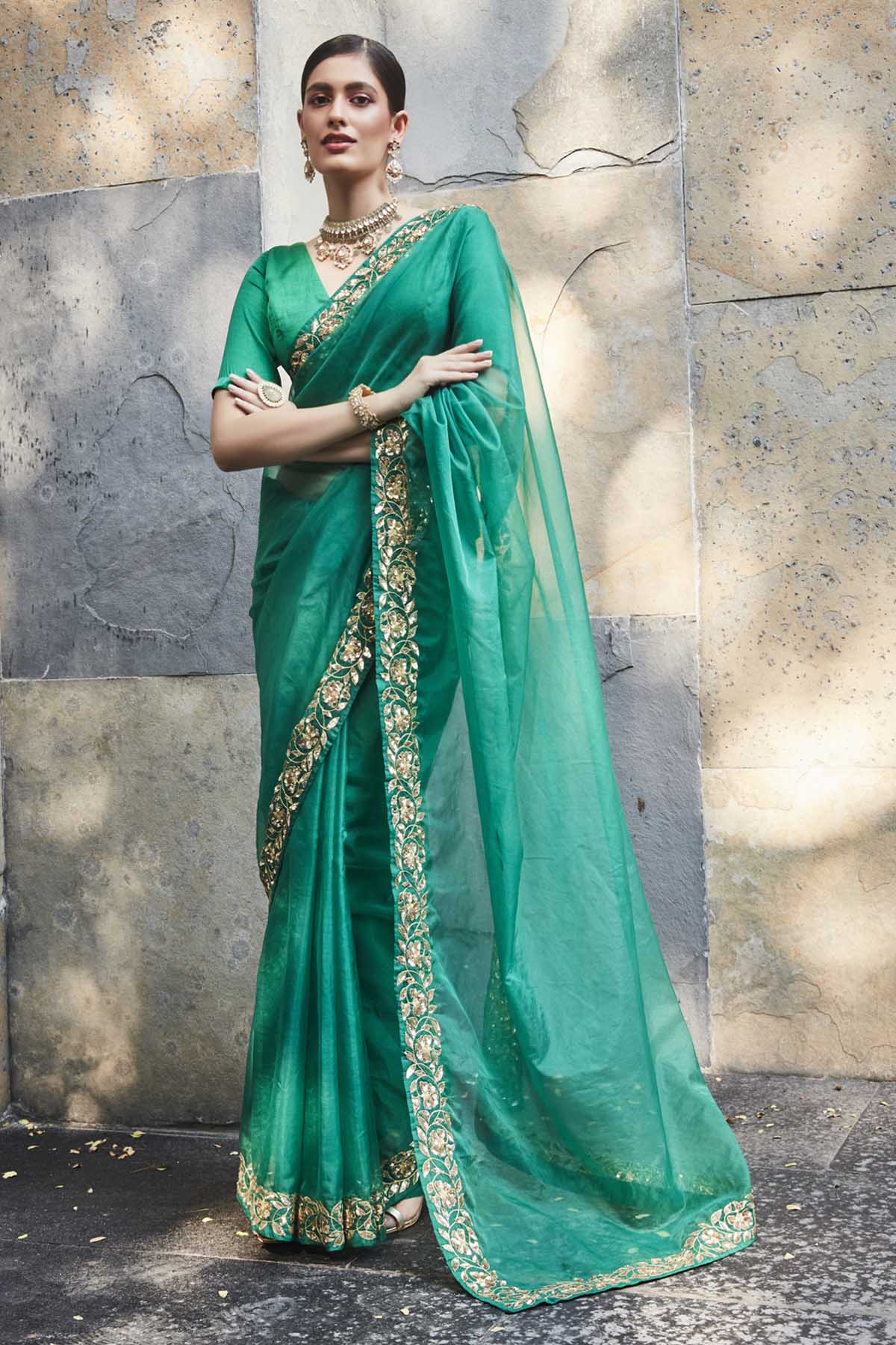Designer Ranian Green silk organza saree with delicate floral pattern border in 3D sequins and zari. The saree comes with a plain satin silk blouse with a back hook For women Online at ScrollnShops