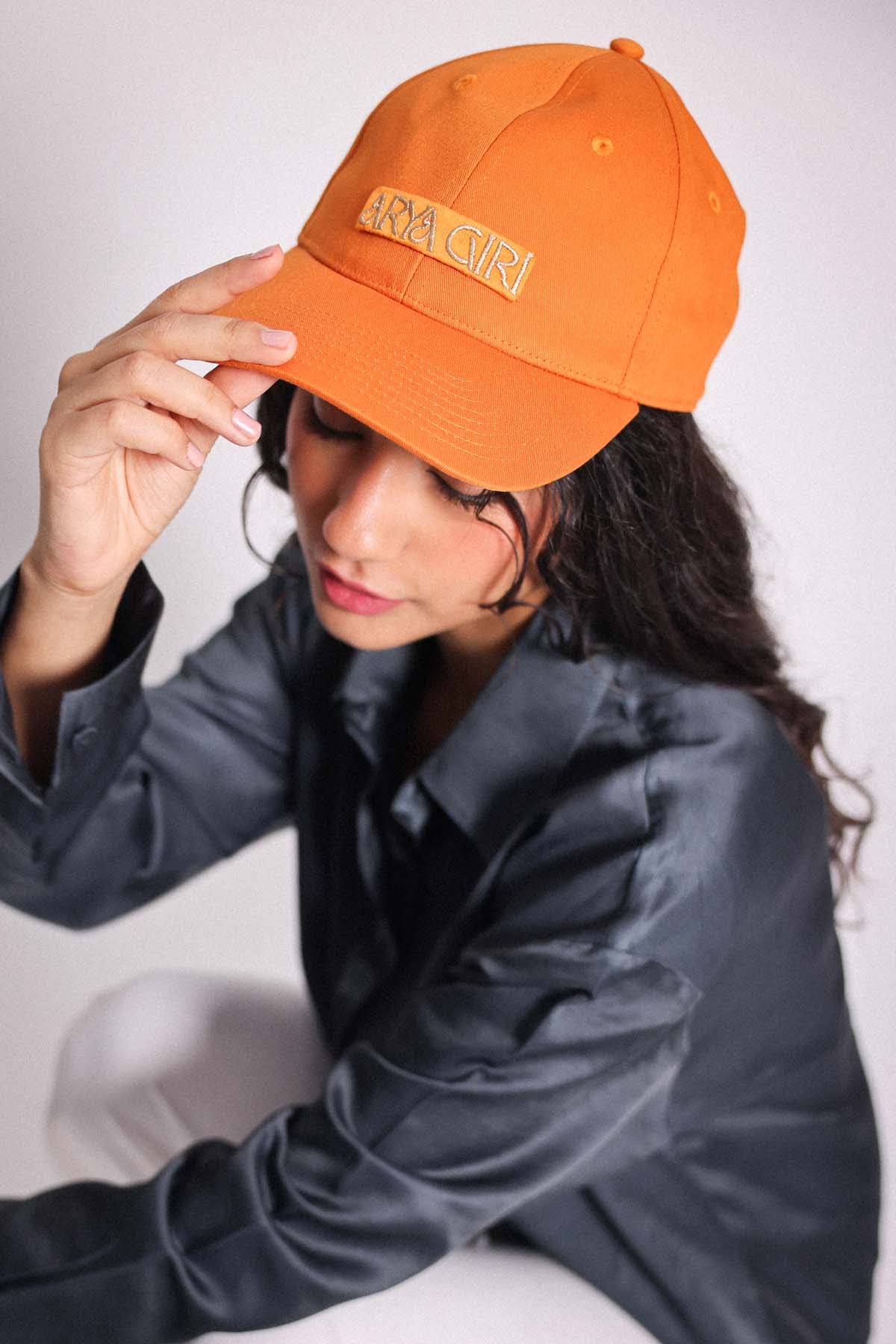 Buy Arya Giri Orange Embroidered Logo Cap