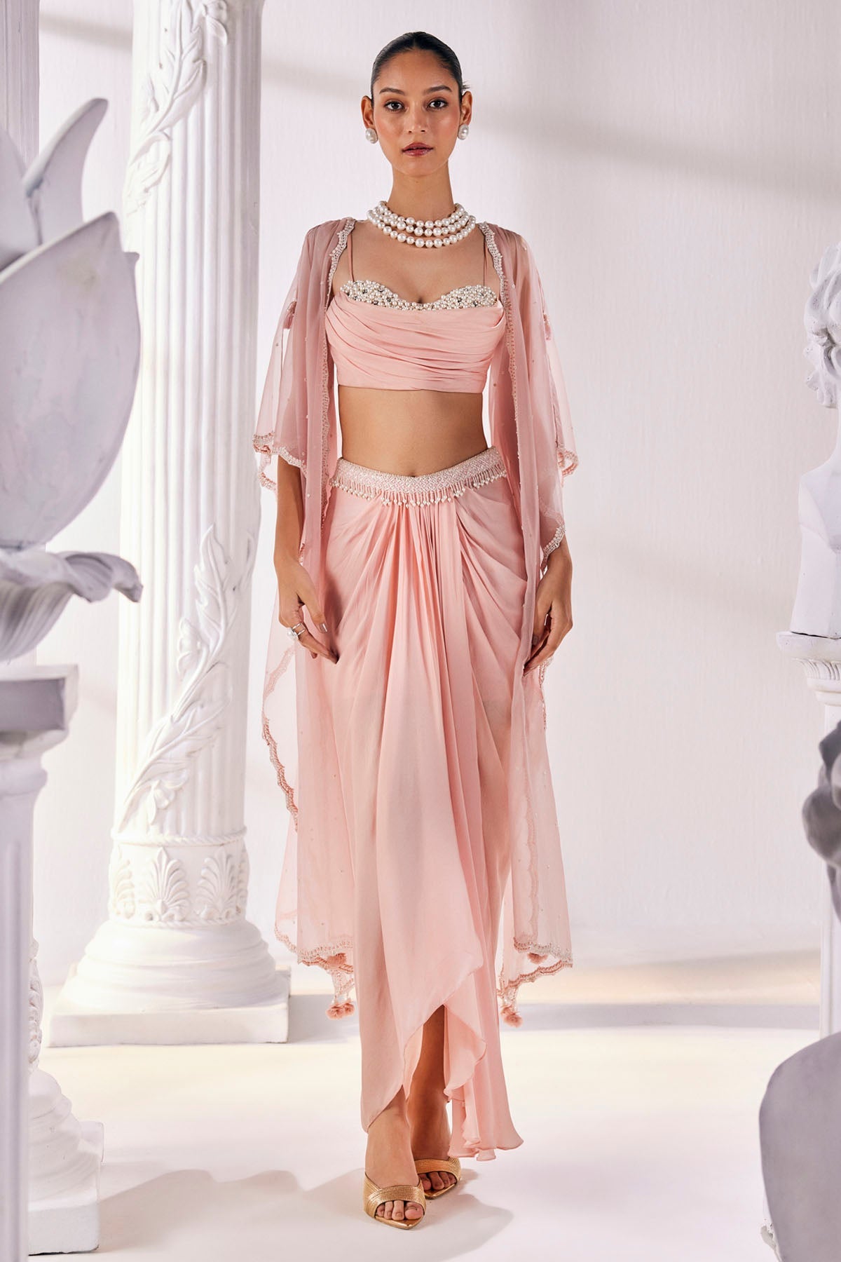 Buy Peach Draped Skirt & Cape Set by Mandira Wirk