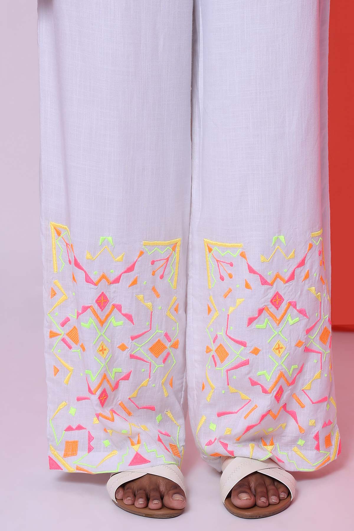 White Sleeveless Top & Trousers