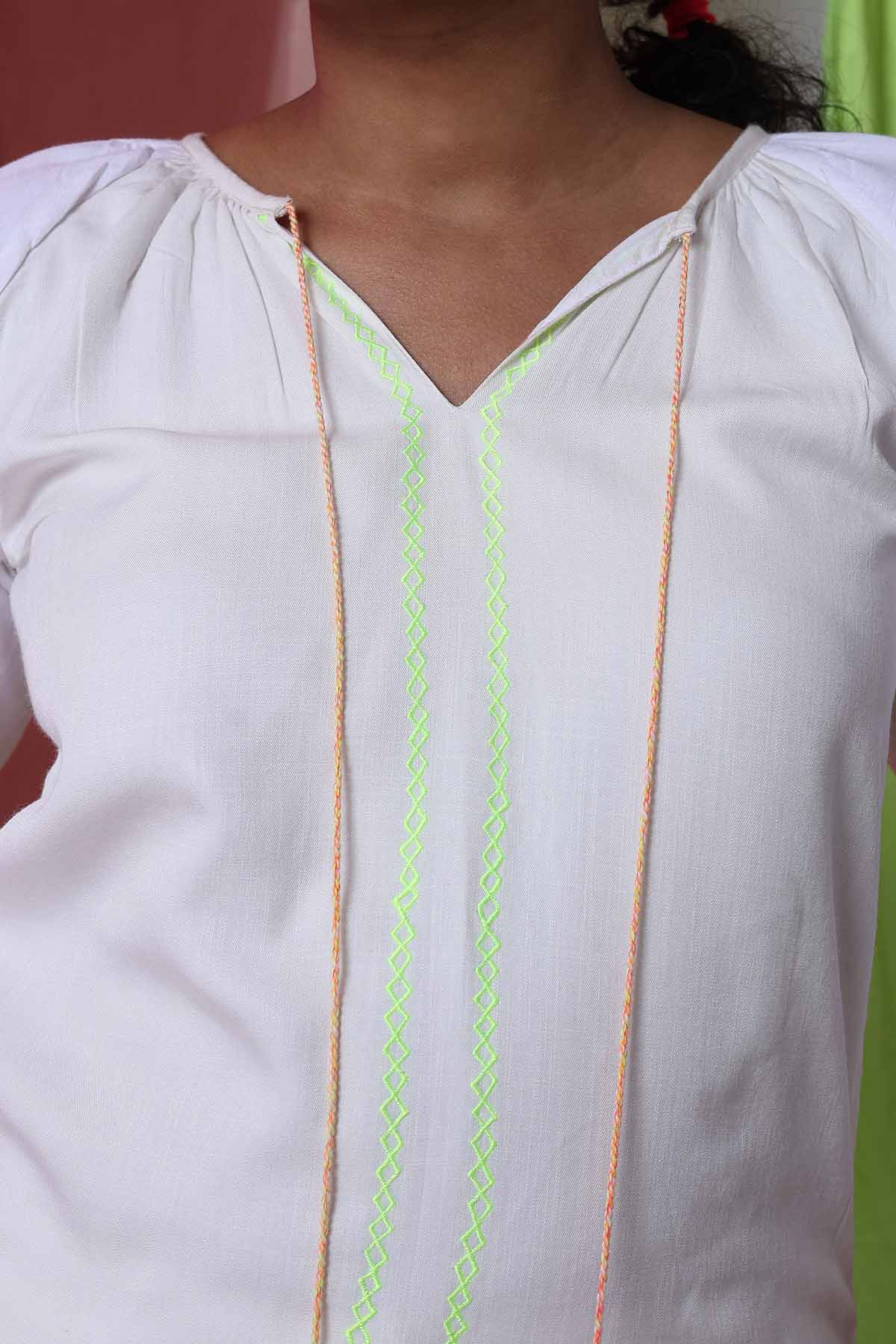 White Top & Embroidered Pants