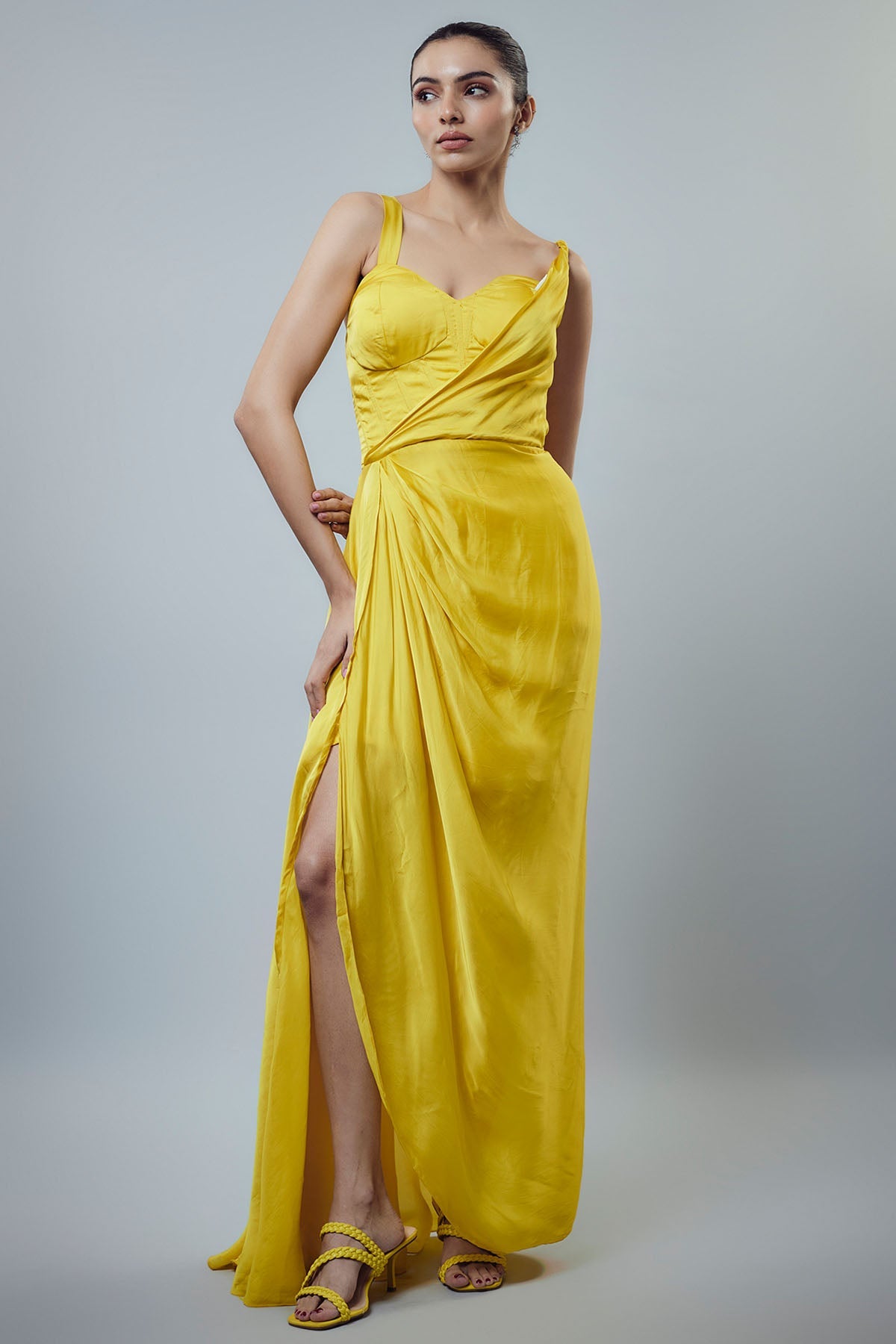 Buy Yellow Sleeveless Drape Gown by Emblaze for women online at ScrollnShops