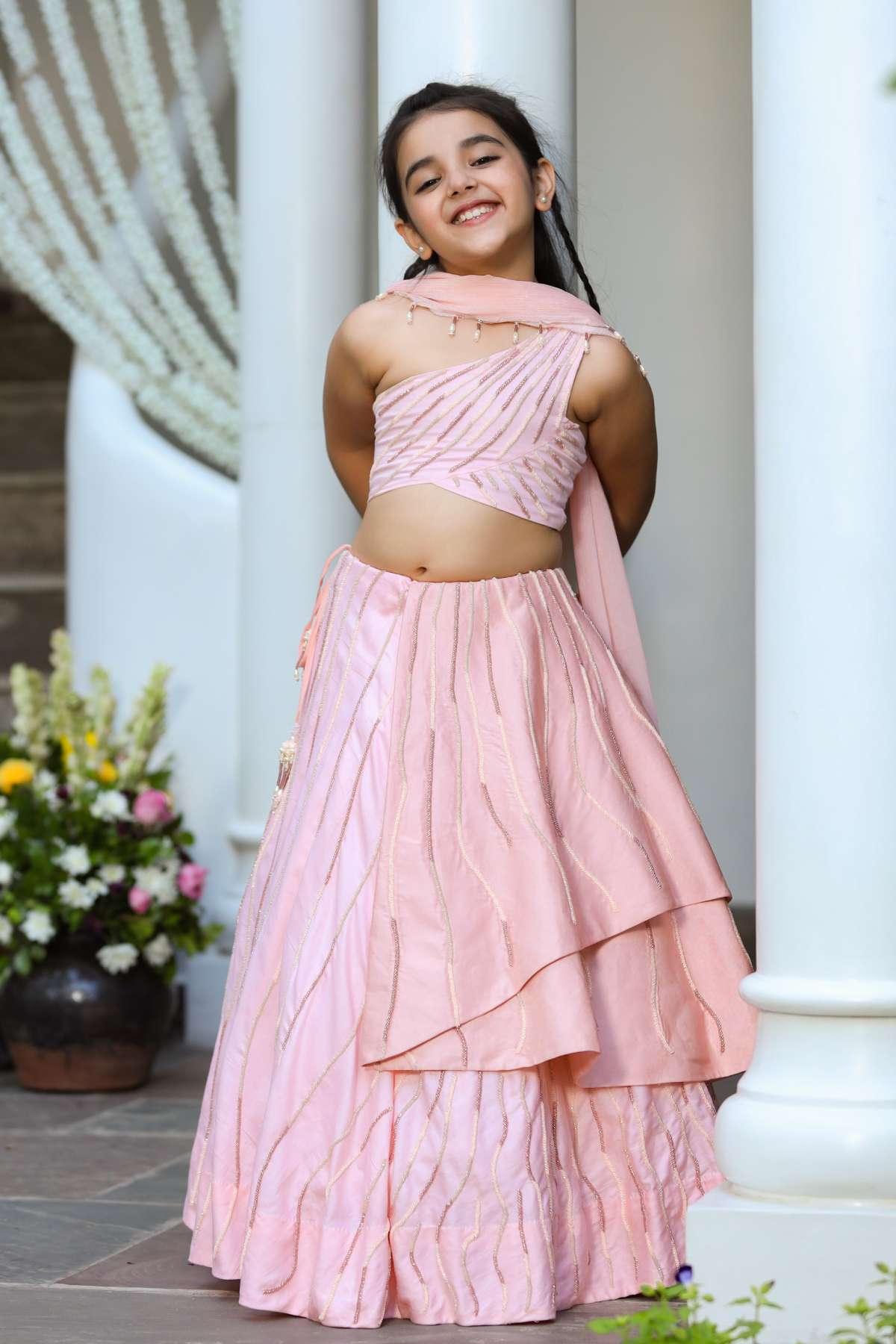 Buy Kids Designer Littleens Delicate brushstroke embroidered lehenga with origami folds at the waist, ethereal rose, intricate enamelled trellis paired with in-cuff blouse and chinon embroidered dupatta Online at ScrollnShops