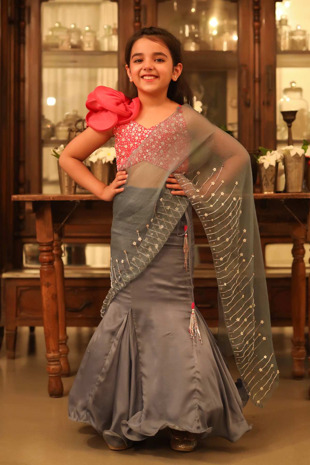 Buy Kids Designer Littleens Sequins embroidered draped saree with embroidered dramatic blouse. The sleek straight skirt kicks into a trumpet bottom adding the right amount of volume Online at ScrollnShops