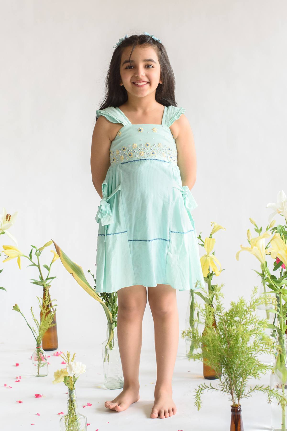 Buy Kids Designer Littleens A-line fit dress with flared straps, embroidered yoke, fagoting at waist and hem and bow tie-ups Online at ScrollnShops