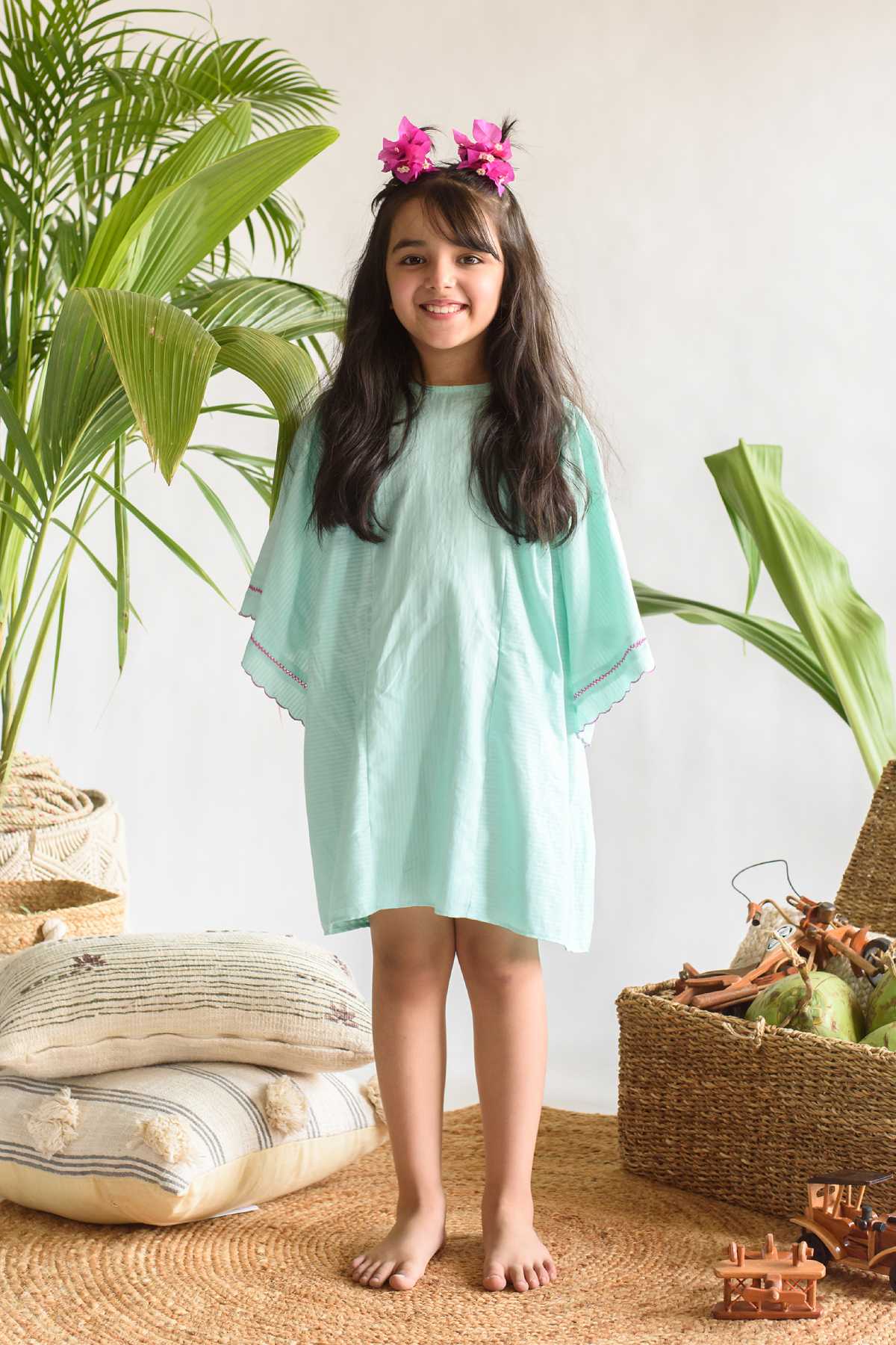 Buy Kids Designer Littleens Dress with delicate hand cross-stitch, angel sleeves and gathers below the waistline in the side panels Online at ScrollnShops