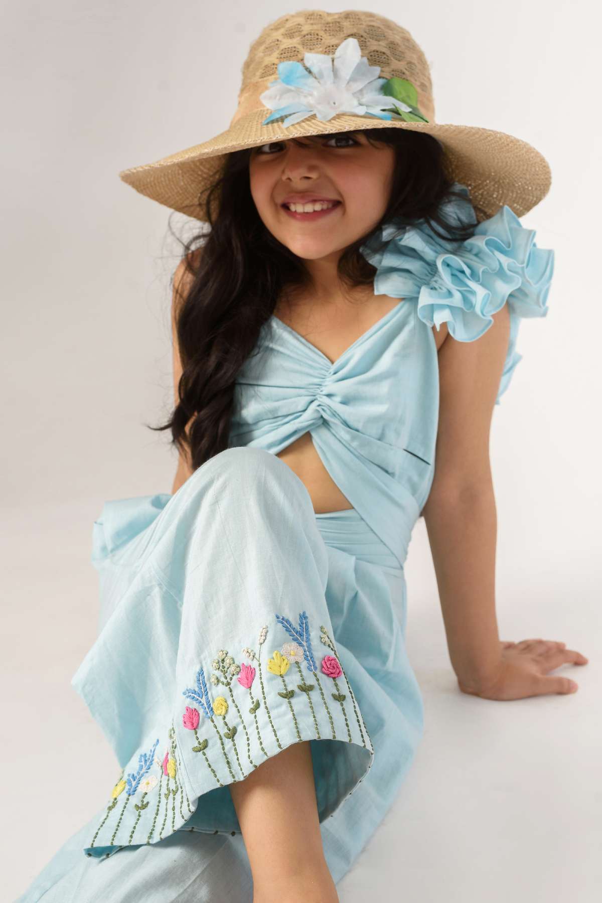 Buy Kids Designer Littleens Cut-out frilled jumpsuit with pockets and the finest thread embroidery detailing at the hem Online at ScrollnShops